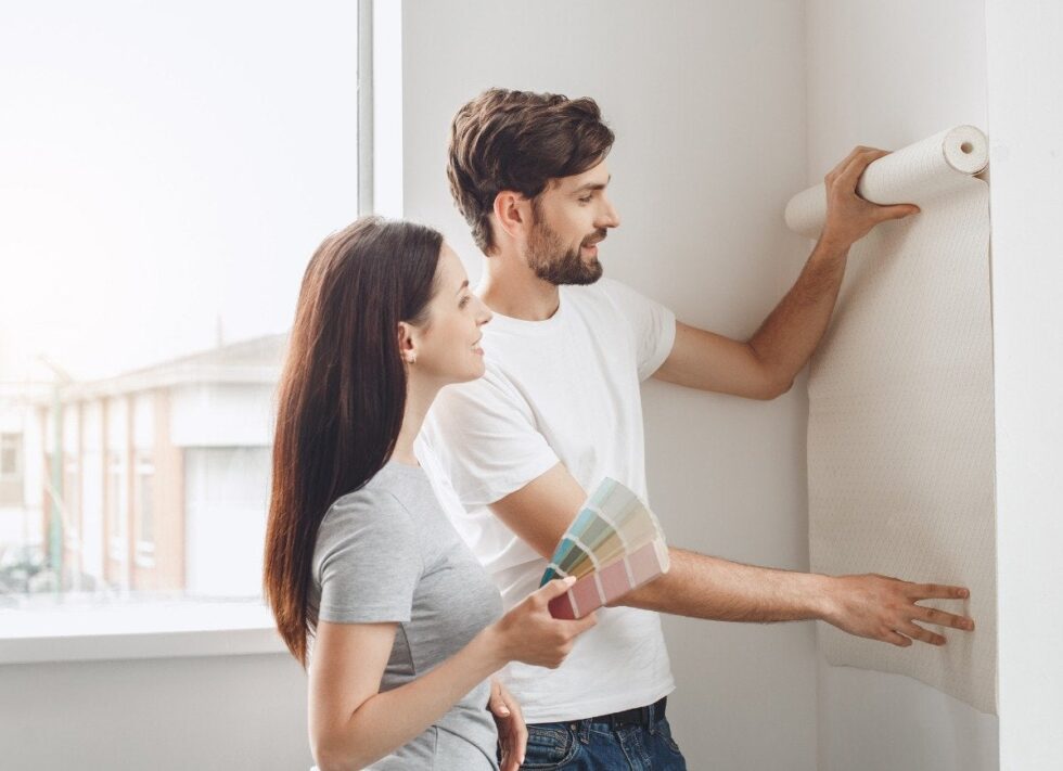 Young couple doing apartment repair together themselves picture
